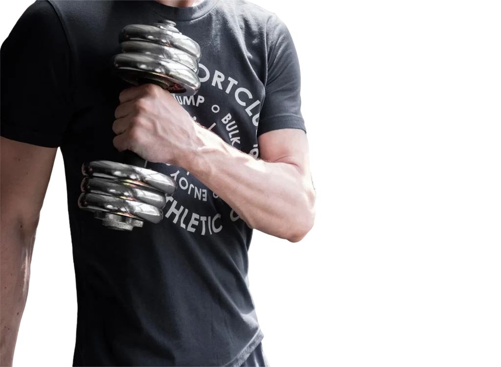 Man lifting a chrome dumbbell while wearing a custom-fitted black gym T-shirt printed by USA Tees for athletic apparel branding in Brooklyn.